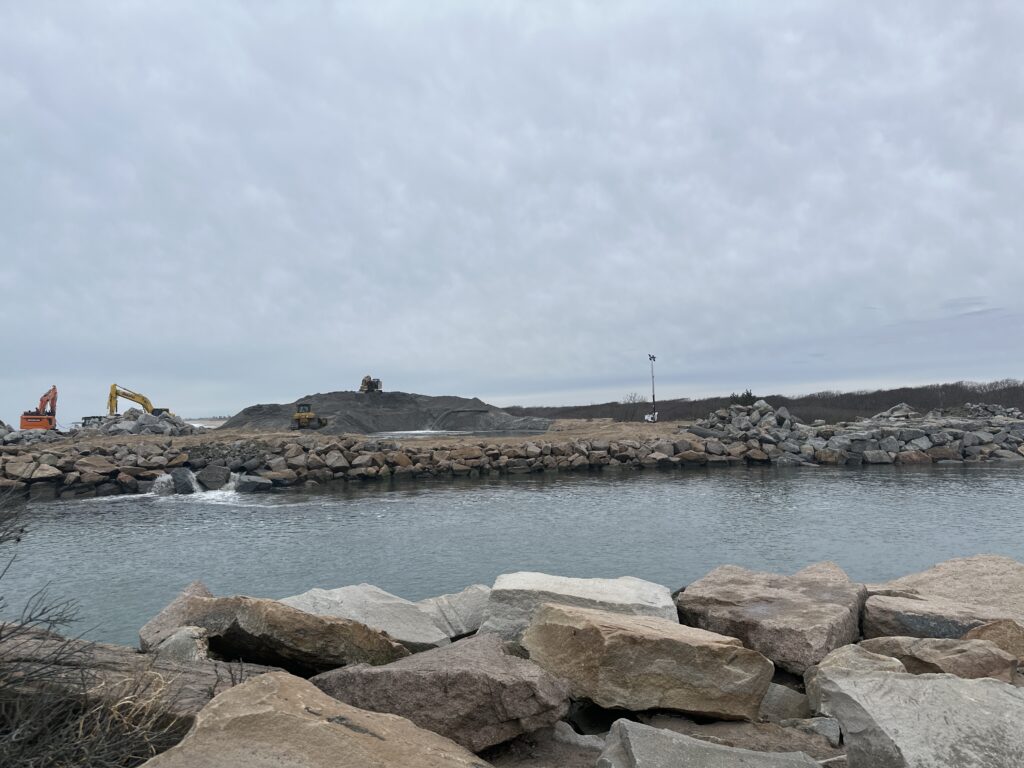 a rocky beach with a body of water in the background (MyCoast AI)