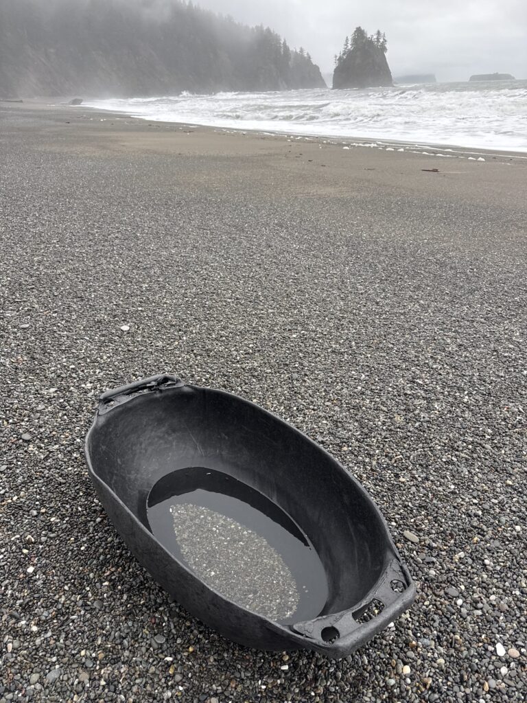 a tire on a beach (MyCoast AI)