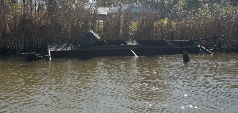a house on a dock in a lake (MyCoast AI)