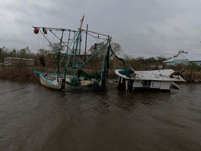 a couple of boats in a muddy river (MyCoast AI)