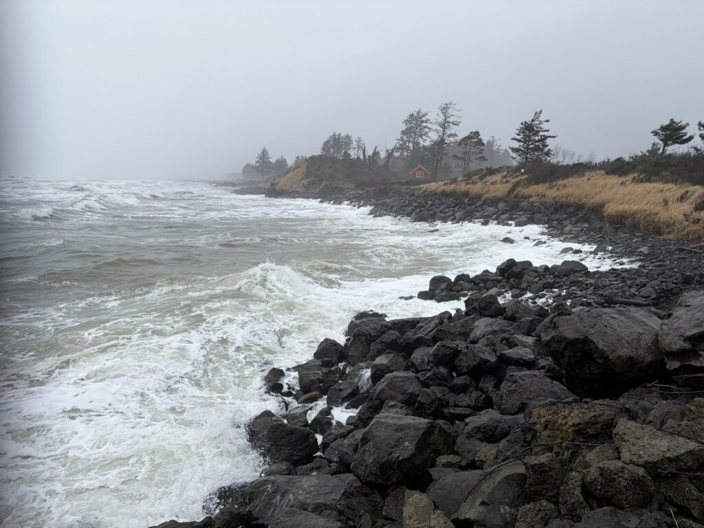 a rocky beach with waves crashing (MyCoast AI)
