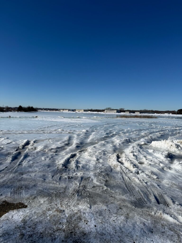 a large field with snow (MyCoast AI)