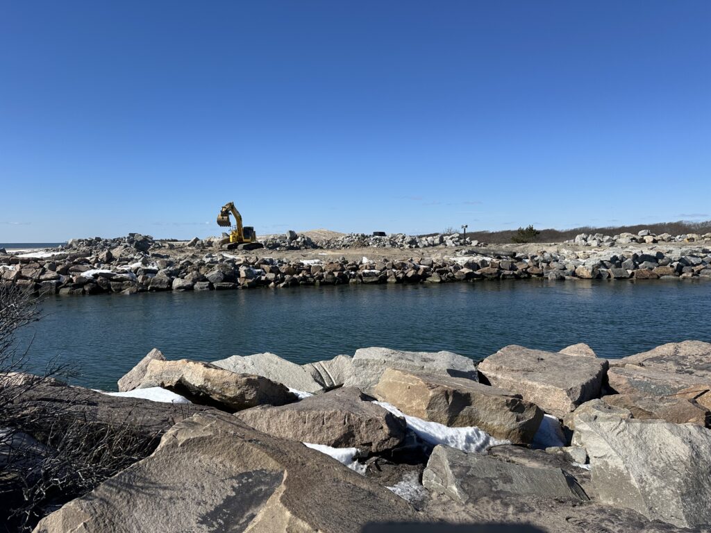 a rocky beach with a body of water in the background (MyCoast AI)