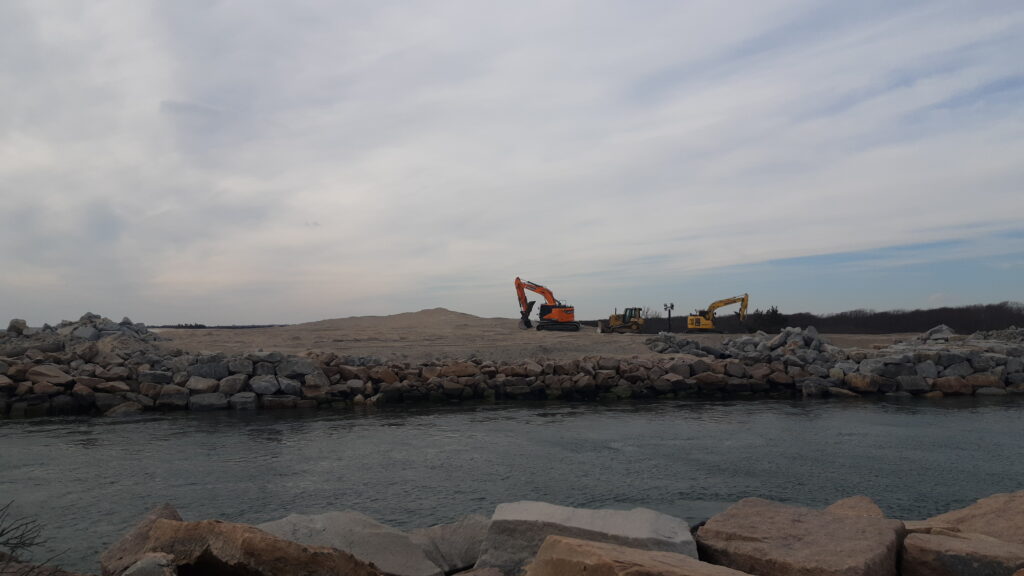 a construction vehicle on a rocky shore (MyCoast AI)