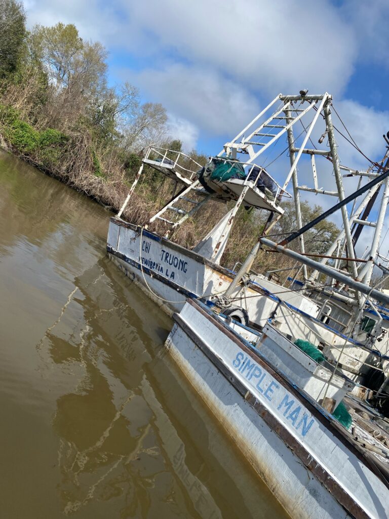 a boat is parked on the side of a river (MyCoast AI)