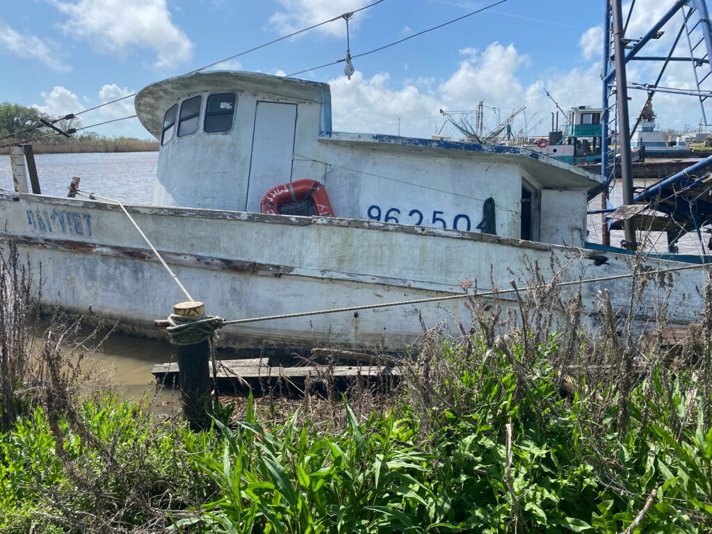 a boat sits on the shore (MyCoast AI)