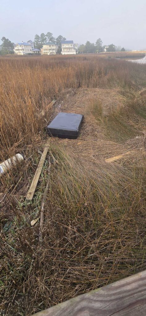 a black box on a grassy field (MyCoast AI)