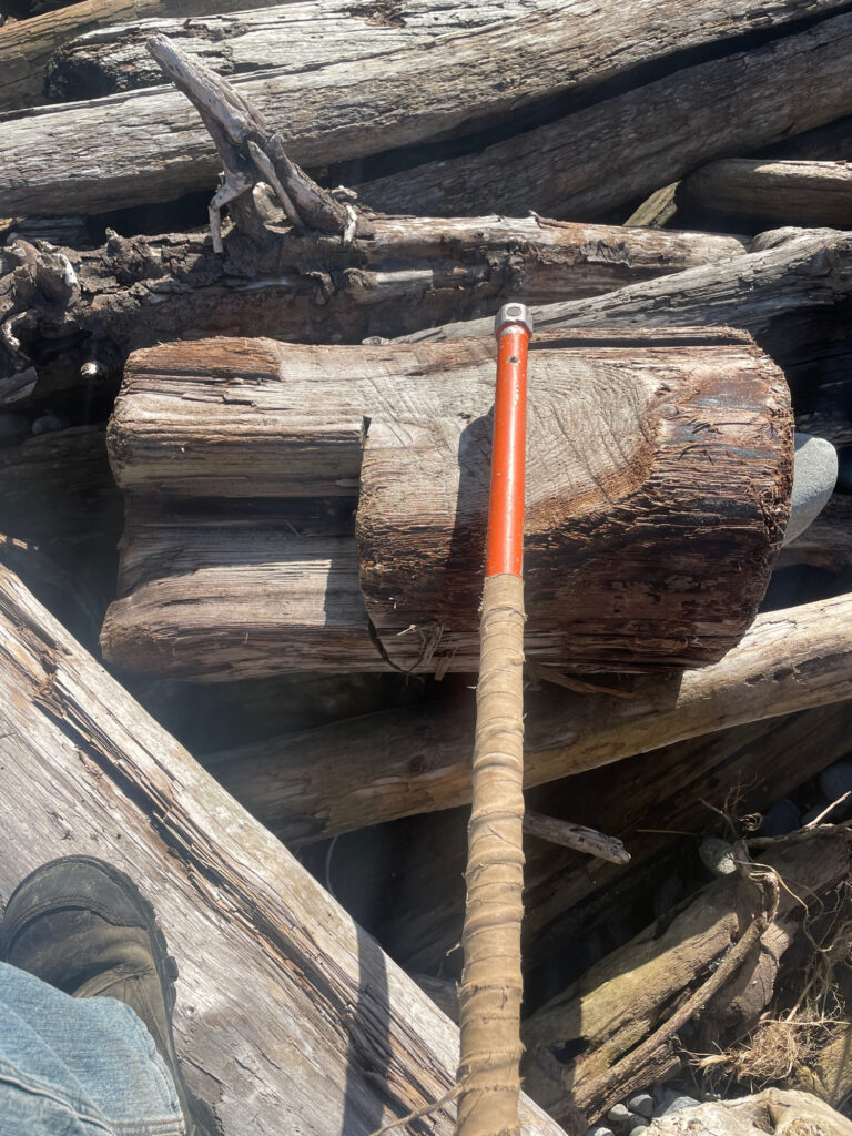 a wooden pole with a stick in it (MyCoast AI)