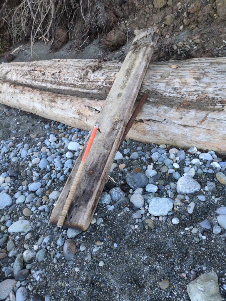 a wooden cross on a rocky surface (MyCoast AI)
