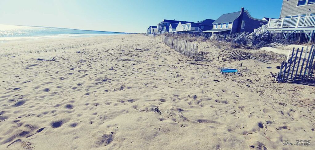 a beach with chairs and a fence (MyCoast AI)