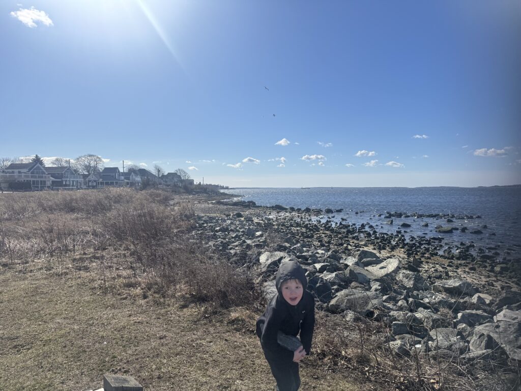 a person standing on a rocky beach (MyCoast AI)
