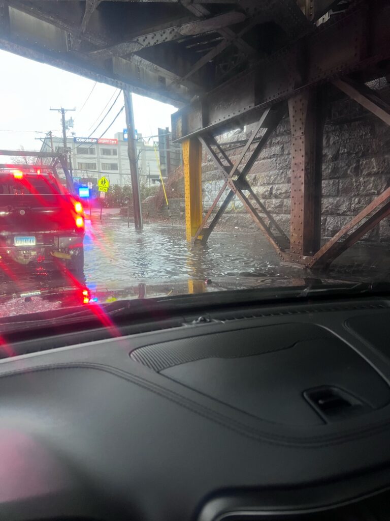 a car driving under a bridge (MyCoast AI)