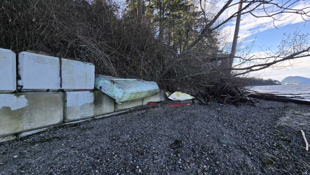 a group of white boxes on a concrete surface by trees (MyCoast AI)