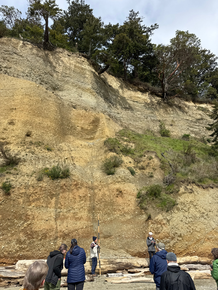 a group of people standing on a hill (MyCoast AI)