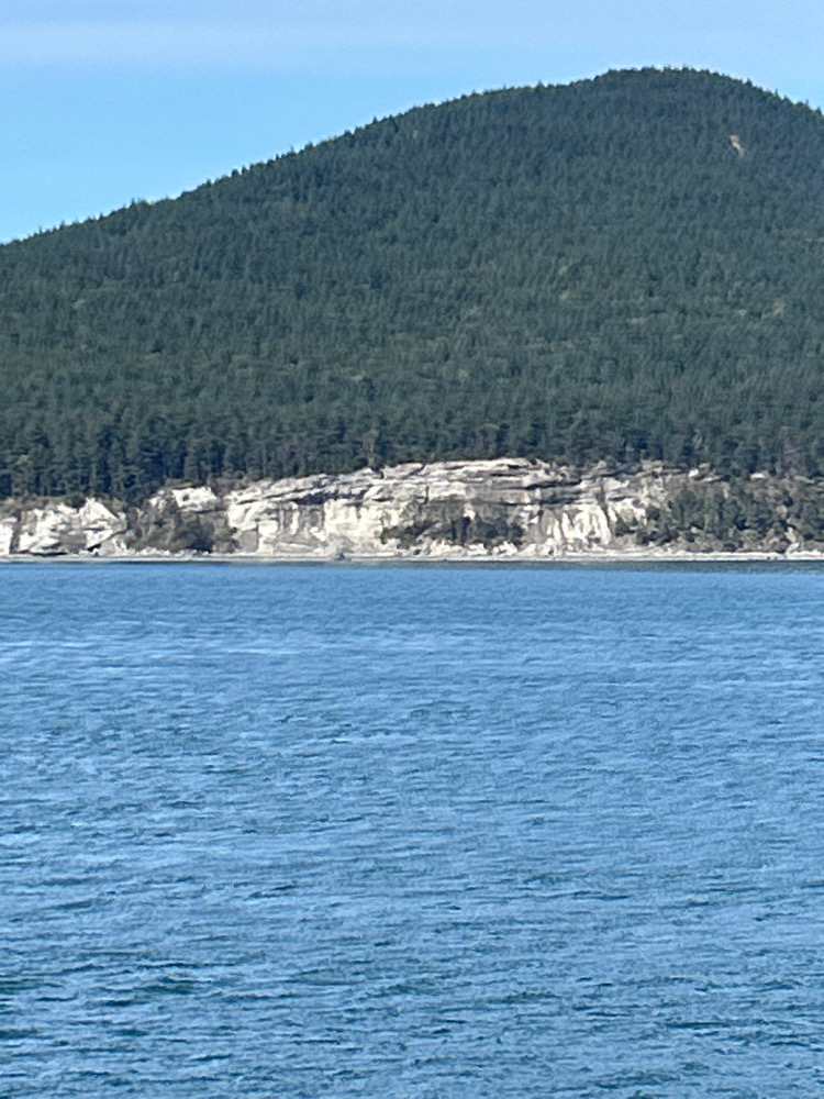 a body of water with a mountain in the background (MyCoast AI)