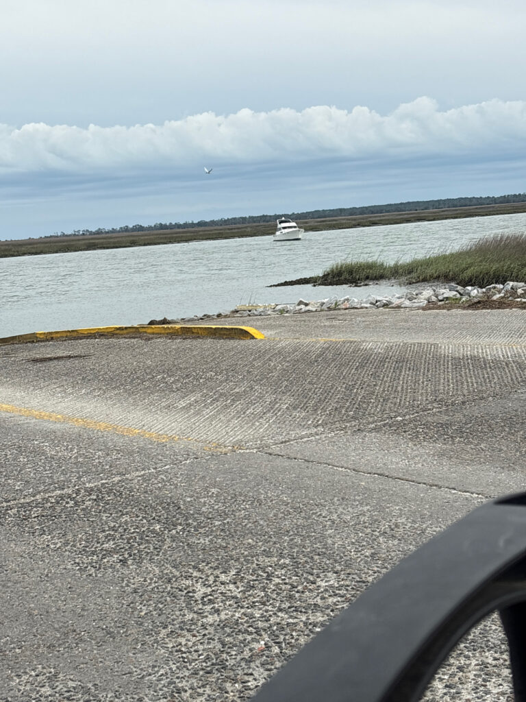 a road next to a body of water (MyCoast AI)