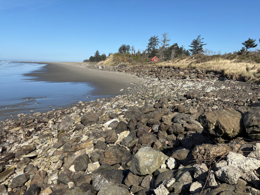 a rocky beach with a body of water in the background (MyCoast AI)