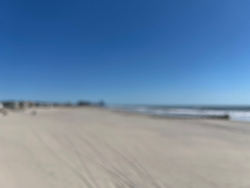 a sandy beach with waves (MyCoast AI)
