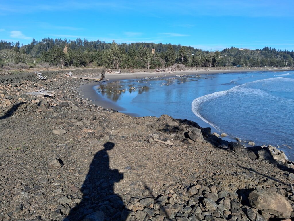 a person's shadow on a rocky beach (MyCoast AI)