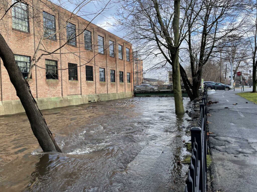 a flooded street with a building (MyCoast AI)