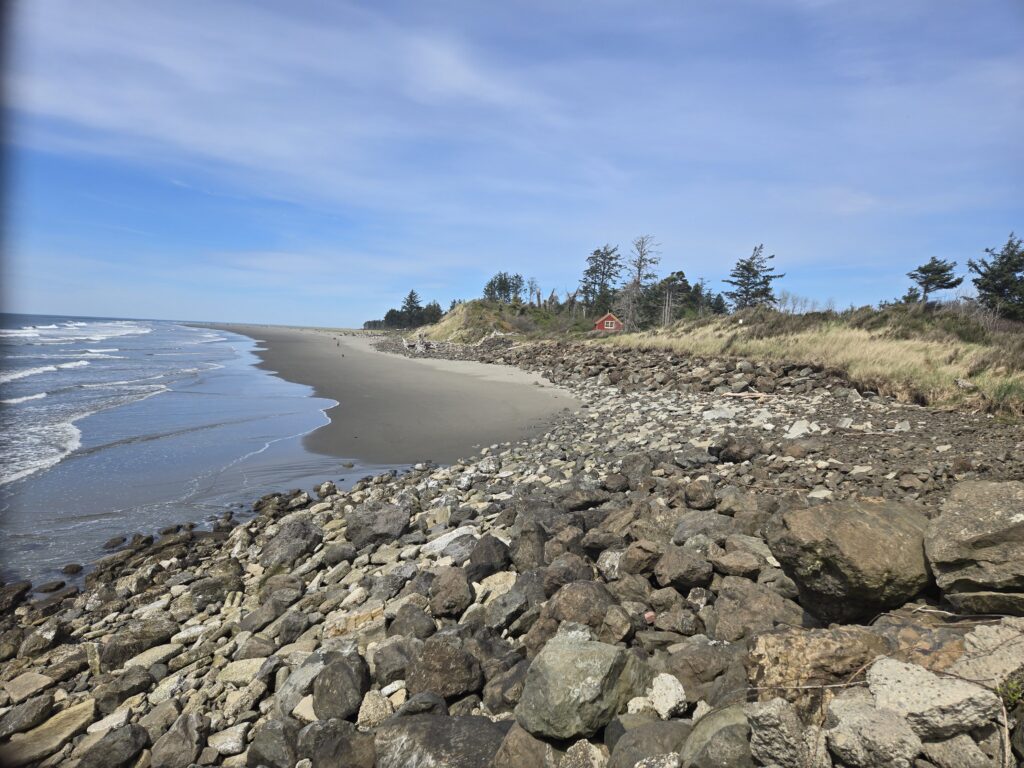 a rocky beach with a sandy beach (MyCoast AI)