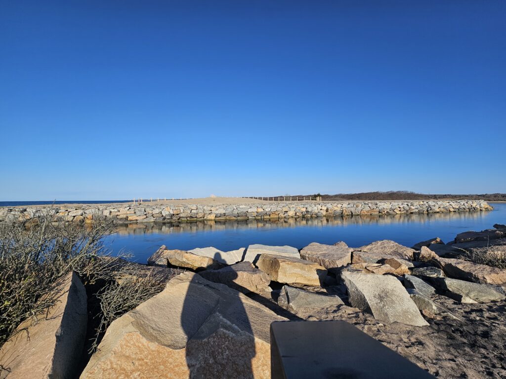 a group of rocks by a body of water (MyCoast AI)