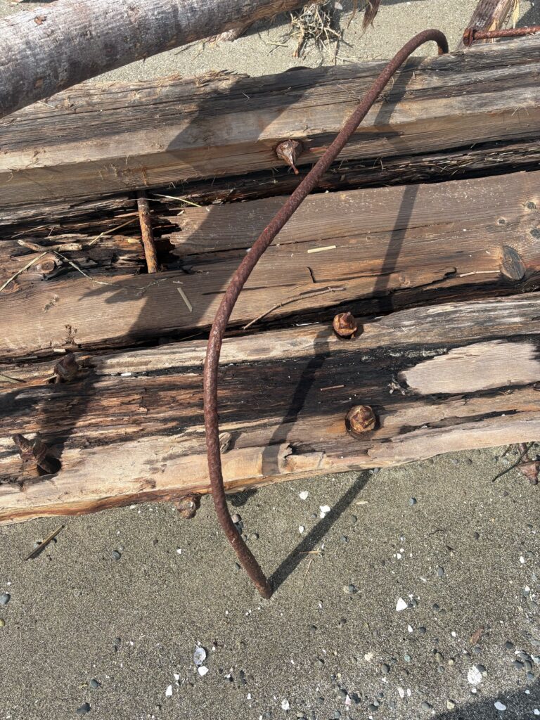 a wooden cross on a wooden surface (MyCoast AI)