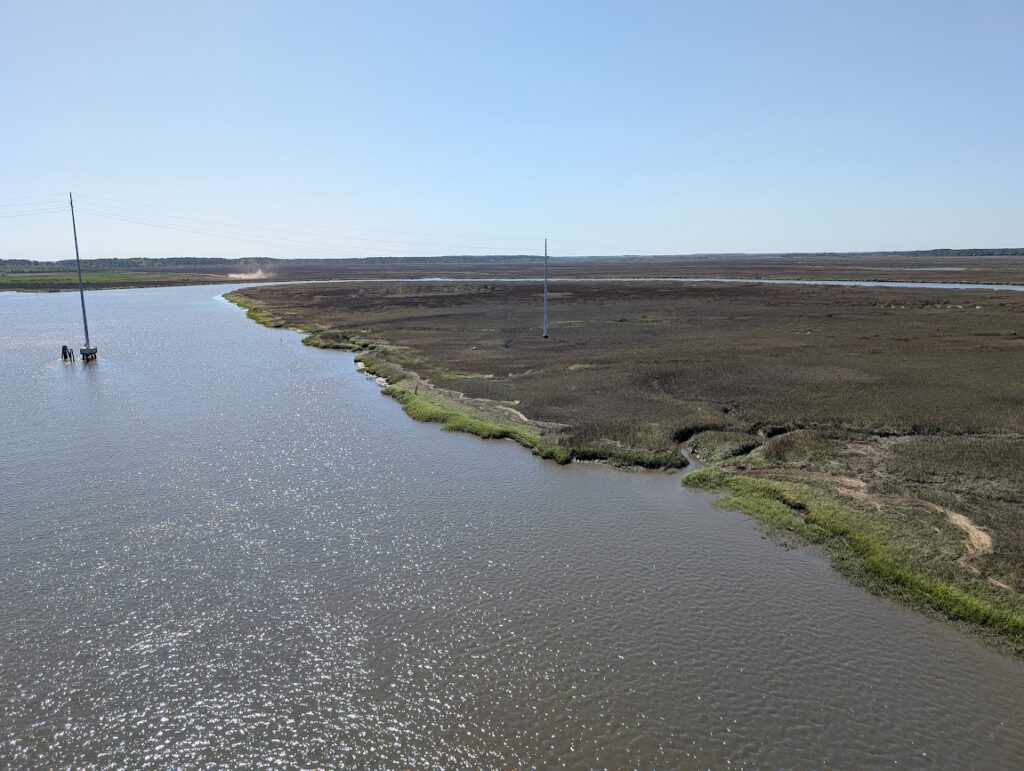 a river with a small bridge (MyCoast AI)