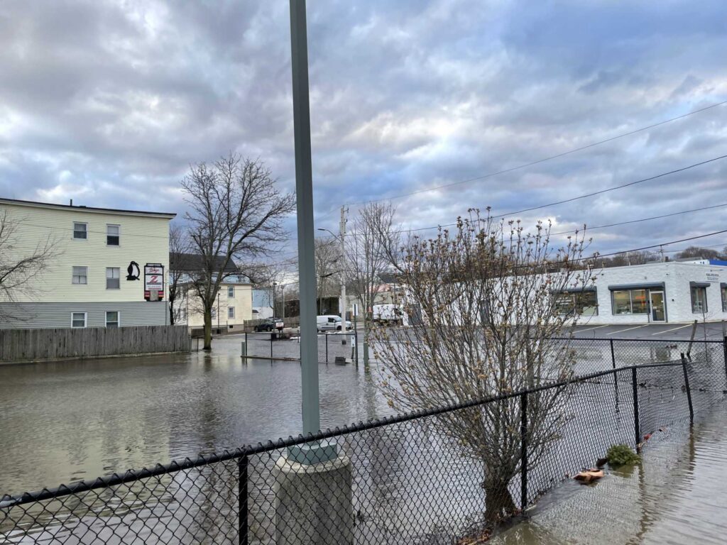 a flooded street with buildings and trees (MyCoast AI)