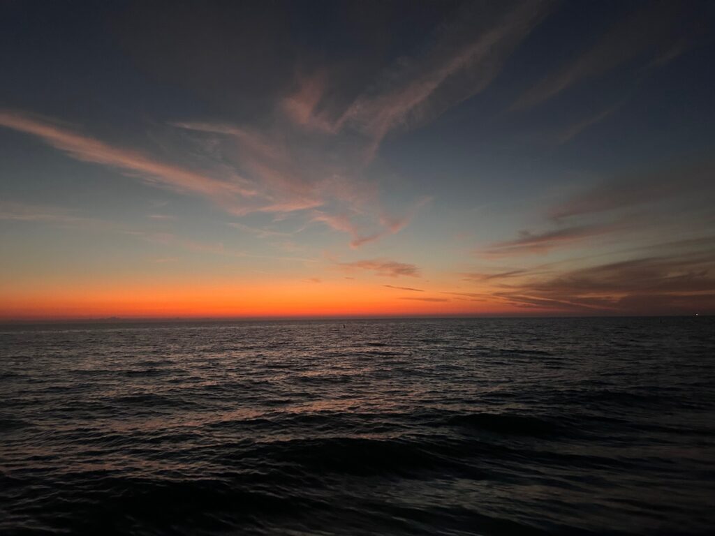 a sunset over the ocean (MyCoast AI)