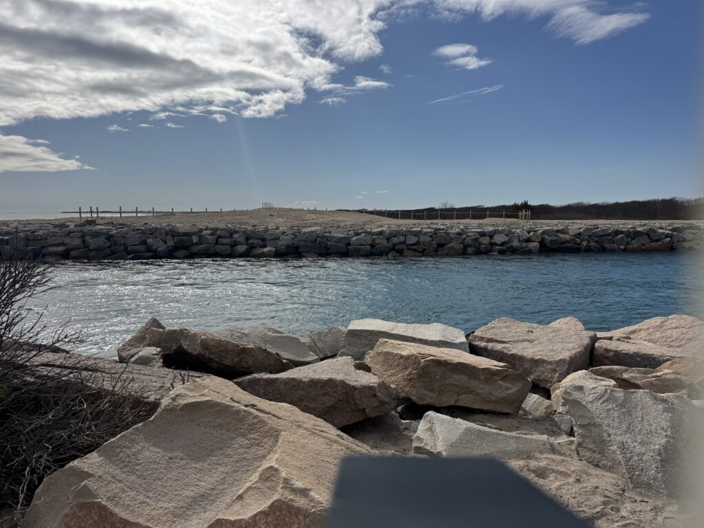 a rocky beach with a body of water in the background (MyCoast AI)