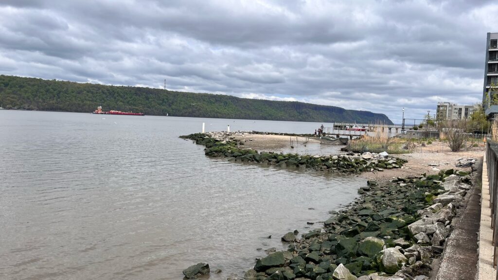 a body of water with rocks and a dock by it (MyCoast AI)
