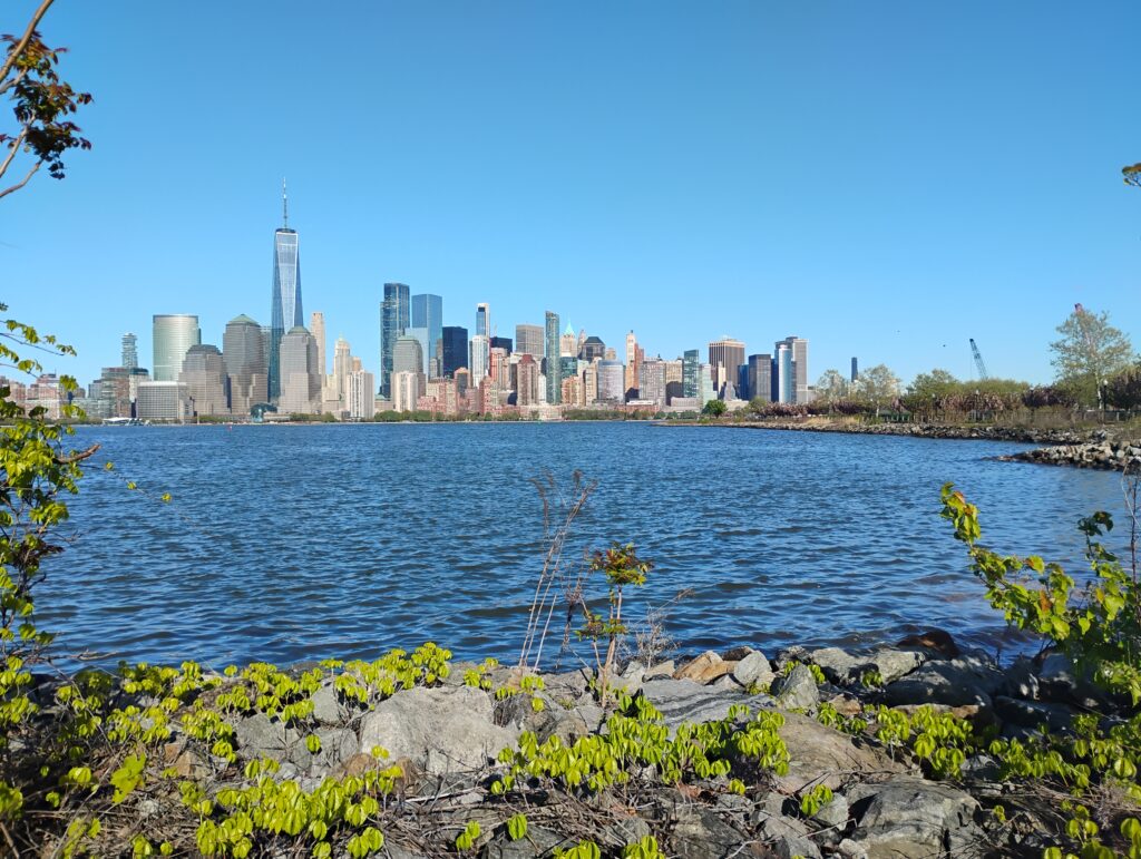 a city skyline across a body of water (MyCoast AI)