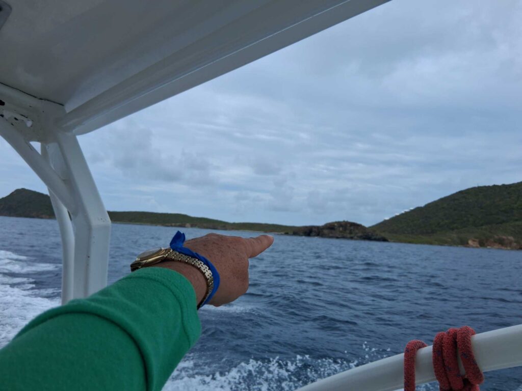 a hand on a boat (MyCoast AI)