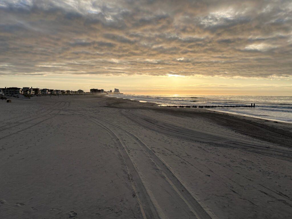 a sandy beach with a sunset (MyCoast AI)
