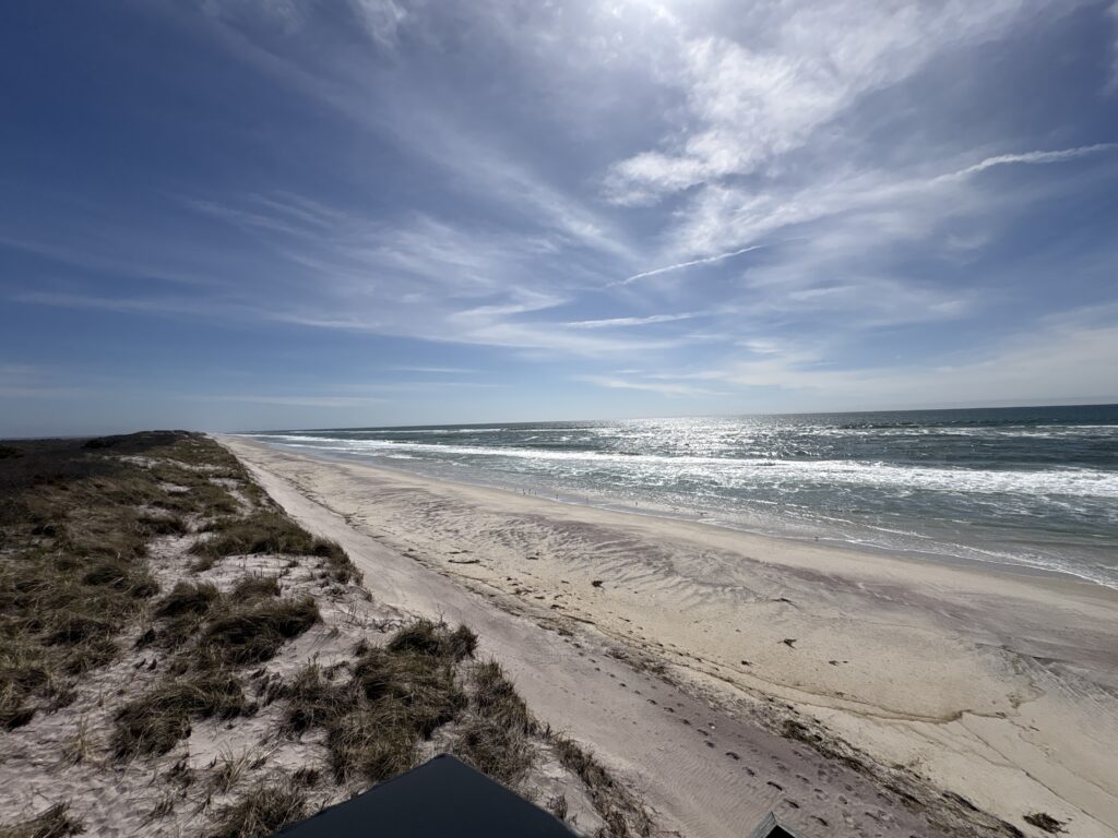 a beach with waves crashing on it (MyCoast AI)