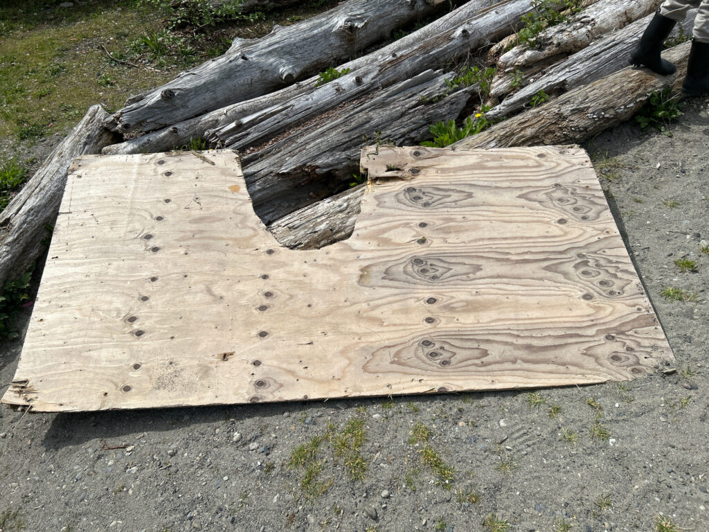 a wooden bench with writing on it (MyCoast AI)