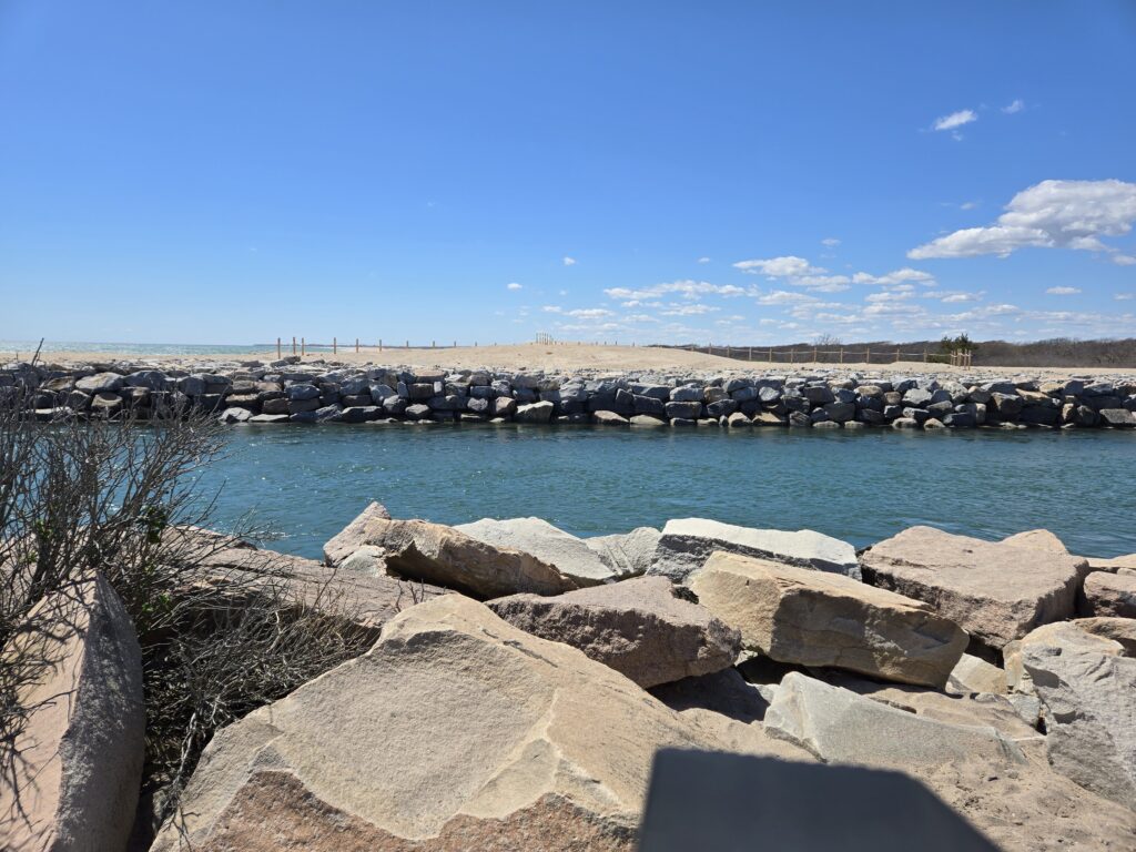 a rocky beach with a body of water in the background (MyCoast AI)