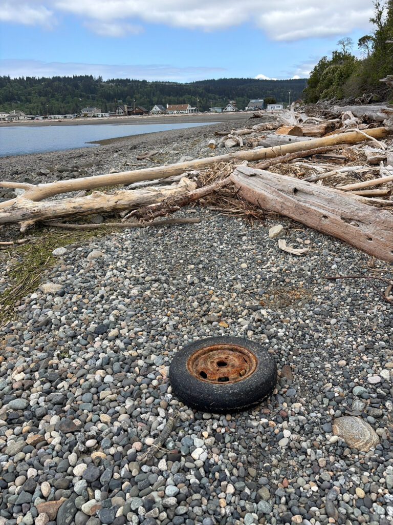 a tire on a rocky beach (MyCoast AI)