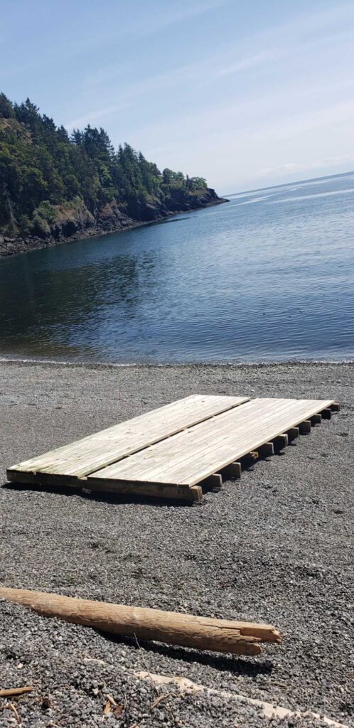a wood bench on a beach (MyCoast AI)