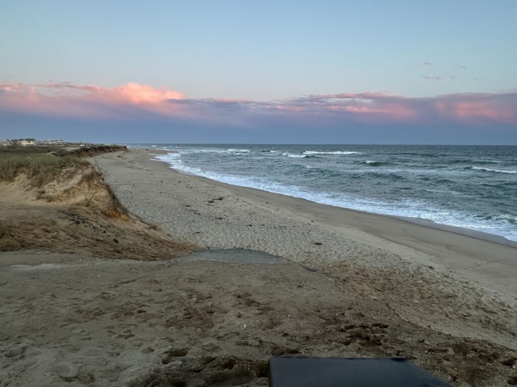 a sandy beach with waves crashing on it (MyCoast AI)